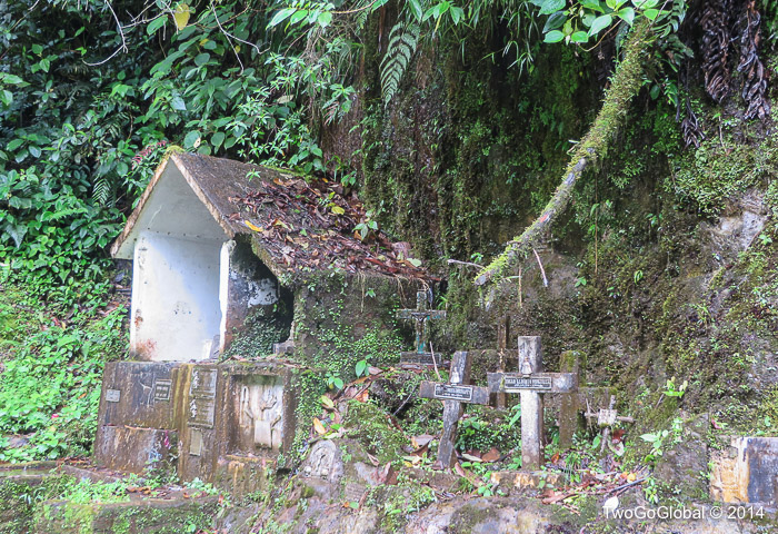 Crosses recognizing the dead, probably after a bus plunged over the edge
