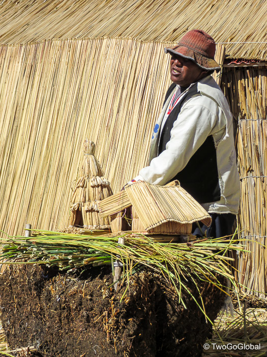 A local Uros showing how to build an island