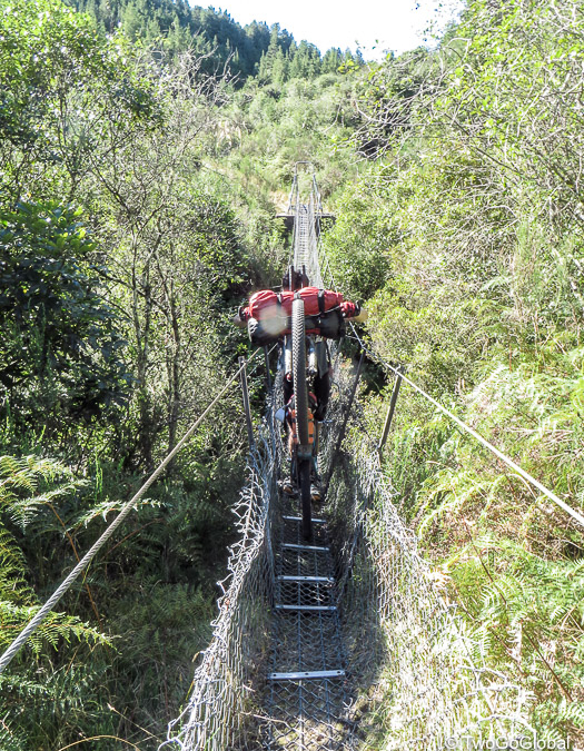 A very precarious chain bridge